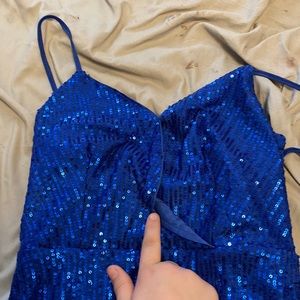 A short sparkly NOT see through dress. It zips in back and comes to thigh